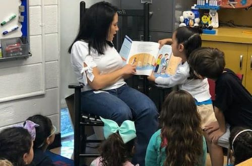 Volunteer reading to children